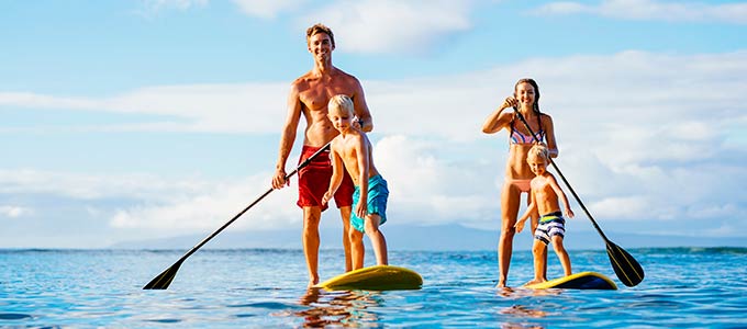 Family on paddle boards