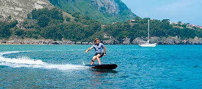 Riding an electric-powered surf board