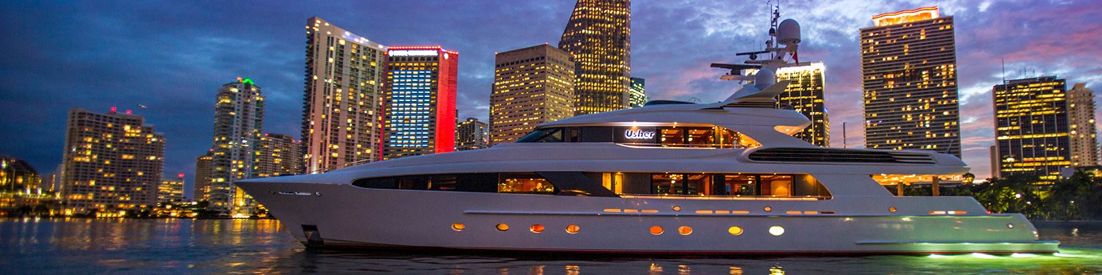 Luxury yacht with Miami skyline in background